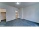 Simple bedroom with soft carpet and access to a private bath at 4927 S Tune --, Mesa, AZ 85212