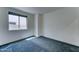 Cozy bedroom with a large window and soft carpet at 4927 S Tune --, Mesa, AZ 85212