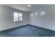 Bedroom with carpet flooring, base trim and multiple windows at 4927 S Tune --, Mesa, AZ 85212