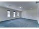 Carpeted bonus room featuring multiple windows, and neutral color palette at 4927 S Tune --, Mesa, AZ 85212