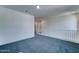Upstairs bonus room with carpet flooring, white trim and railing at 4927 S Tune --, Mesa, AZ 85212
