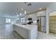 An open-concept kitchen boasts stainless steel appliances and a center island at 4927 S Tune --, Mesa, AZ 85212