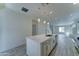 Bright kitchen featuring a spacious island with pendant lighting and tile flooring at 4927 S Tune --, Mesa, AZ 85212