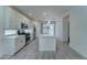 Modern kitchen with stainless steel appliances, a large island, and white cabinets at 4927 S Tune --, Mesa, AZ 85212