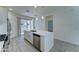 Modern kitchen with stainless steel appliances, a large island, and white cabinets at 4927 S Tune --, Mesa, AZ 85212