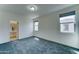 Spacious main bedroom with neutral carpeting, natural light, and an ensuite bathroom at 4927 S Tune --, Mesa, AZ 85212