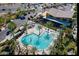 Aerial view of the community pool area, with palm trees and lounge chairs at 4927 S Tune --, Mesa, AZ 85212