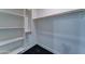 Well-organized walk-in closet with multiple shelves and hanging rods for optimal storage at 4927 S Tune --, Mesa, AZ 85212
