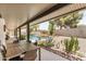 Inviting backyard with covered patio featuring table with pool and desert landscaping views at 527 N Criss St, Chandler, AZ 85226