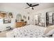 Cozy bedroom features a ceiling fan, ensuite bathroom, and spacious walk-in closet at 527 N Criss St, Chandler, AZ 85226