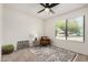 Cozy bedroom with a stylish chair, modern rug and neutral decor at 527 N Criss St, Chandler, AZ 85226