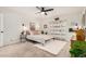Bedroom with carpet features a ceiling fan, boho decor, and natural light at 527 N Criss St, Chandler, AZ 85226