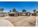 Charming single-story home with a gravel front yard, stone accents, solar panels, and a two-car garage at 527 N Criss St, Chandler, AZ 85226