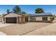 Charming single-story home with a well-maintained yard, solar panels, and an attached two-car garage at 527 N Criss St, Chandler, AZ 85226