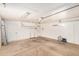 Spacious garage interior featuring concrete flooring, ample lighting, and storage options at 527 N Criss St, Chandler, AZ 85226