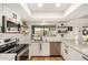 Modern kitchen with white subway tile backsplash, stainless steel appliances, and ample counter space at 527 N Criss St, Chandler, AZ 85226