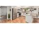 Modern kitchen features stainless steel appliances, white cabinets, subway tile, and terracotta floors at 527 N Criss St, Chandler, AZ 85226
