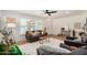 Bright living room with white walls, tile flooring, and a cozy seating area with stylish decor at 527 N Criss St, Chandler, AZ 85226
