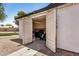 Open shed with double doors, revealing storage space and potential for various uses at 527 N Criss St, Chandler, AZ 85226