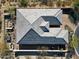 Bird's eye view of an elegant desert home with outdoor entertaining area, desert views, and stone roof at 6251 E Bramble Berry Ln, Cave Creek, AZ 85331