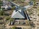 Aerial view of a home in a desert landscape featuring a private backyard oasis with outdoor kitchen and seating at 6251 E Bramble Berry Ln, Cave Creek, AZ 85331