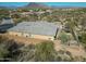 Aerial view showcases a beautiful desert home with a private backyard, mature landscaping, and desert views at 6251 E Bramble Berry Ln, Cave Creek, AZ 85331