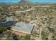 Beautiful aerial view of a desert home featuring a private backyard oasis with mature trees at 6251 E Bramble Berry Ln, Cave Creek, AZ 85331