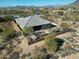 Aerial view of a home with a fenced backyard and outdoor seating area at 6251 E Bramble Berry Ln, Cave Creek, AZ 85331
