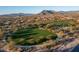 Lush community park with green lawns, walking path, desert landscaping, and mountain views, providing a serene recreation space at 6251 E Bramble Berry Ln, Cave Creek, AZ 85331