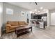 Open concept living room that features tile floors and is connected to the kitchen at 6251 E Bramble Berry Ln, Cave Creek, AZ 85331