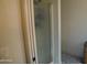 Bathroom features a clean shower with white trim and a glass door, complemented by stylish blue-patterned tile at 6352 W Campo Bello Dr, Glendale, AZ 85308