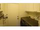 This laundry room features cabinets, a door, and front load washer dryer at 6352 W Campo Bello Dr, Glendale, AZ 85308