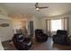 Spacious living room featuring wood floors, comfortable seating, and open floor plan at 6352 W Campo Bello Dr, Glendale, AZ 85308