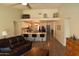 Open-concept living space with view to kitchen, modern decor, and plenty of natural light and vaulted ceilings at 6352 W Campo Bello Dr, Glendale, AZ 85308