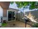 This cozy backyard includes a built-in grill for outdoor dining and entertaining at 7111 N 63Rd Dr, Glendale, AZ 85301