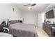Cozy bedroom with tile floors, a television, and closet space at 7111 N 63Rd Dr, Glendale, AZ 85301