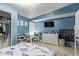 bedroom offers toy storage, ceiling fan, closet, desk, and an accent wall at 7111 N 63Rd Dr, Glendale, AZ 85301