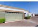 Exterior of a property showing the garage door, trimmed hedges, and a well-maintained driveway at 7111 N 63Rd Dr, Glendale, AZ 85301