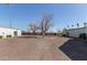Large parking lot with ample parking spaces and landscaping at 7111 N 63Rd Dr, Glendale, AZ 85301