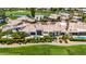 Aerial view of luxurious home, pool, and golf course highlighting a resort-style living at 7475 E Gainey Ranch Rd # 22, Scottsdale, AZ 85258
