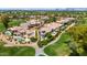 Stunning aerial view of desert homes on the golf course, complete with pools and mature landscaping at 7475 E Gainey Ranch Rd # 22, Scottsdale, AZ 85258