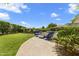 Backyard with a covered patio, an outdoor kitchen, and a green lawn at 7475 E Gainey Ranch Rd # 22, Scottsdale, AZ 85258