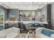 Chic bar area featuring custom cabinetry, stylish seating, and modern lighting fixtures at 7475 E Gainey Ranch Rd # 22, Scottsdale, AZ 85258