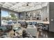 Entertainer's dream: a sophisticated bar with views to the outdoor lounge area and pool at 7475 E Gainey Ranch Rd # 22, Scottsdale, AZ 85258
