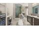 Elegant bathroom boasts a walk-in shower, dual vanities, makeup area, and modern finishes at 7475 E Gainey Ranch Rd # 22, Scottsdale, AZ 85258