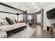 Bedroom with modern ceiling fan, a bed, and a desk at 7475 E Gainey Ranch Rd # 22, Scottsdale, AZ 85258