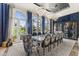 Beautiful dining room with seating for twelve, chandelier lighting, and access to the grounds at 7475 E Gainey Ranch Rd # 22, Scottsdale, AZ 85258