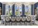 Elegant dining room featuring a long table, decorative chairs, and large windows with views at 7475 E Gainey Ranch Rd # 22, Scottsdale, AZ 85258