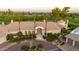 Beautiful custom home with circular driveway, and lush landscaping in front of golf course setting at 7475 E Gainey Ranch Rd # 22, Scottsdale, AZ 85258