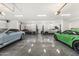 Spacious garage featuring multiple car lifts, polished flooring, and ample lighting at 7475 E Gainey Ranch Rd # 22, Scottsdale, AZ 85258